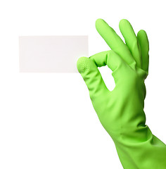 Image showing Hand in green glove showing business card