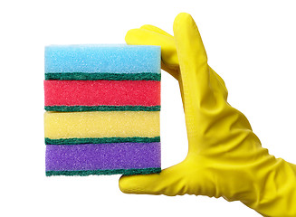 Image showing Hand holding a pile of washing sponges