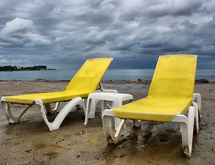 Image showing Yellow chairs on beach