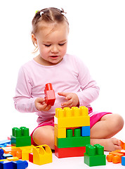 Image showing Little girl with building bricks