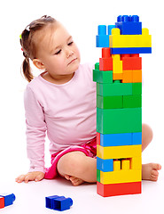 Image showing Little girl with building bricks