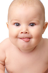 Image showing Happy toddler smiling, sticking his tongue out