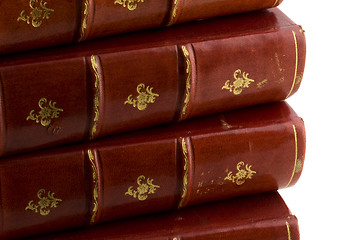 Image showing stack of old books in red leather