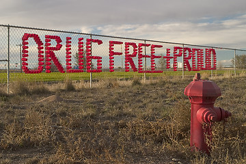 Image showing drug free and proud - school chain fence