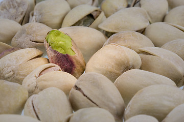 Image showing pistachios nuts with a selective focus and spot light