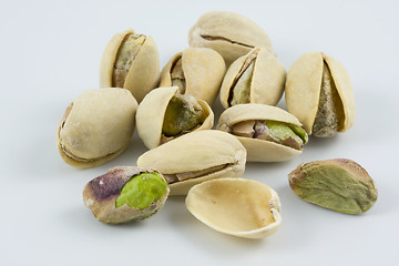 Image showing dozen of salted and roasted pistachio nuts