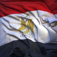 Image showing Flag of Egypt, fluttering in the breeze, backlit rising sun