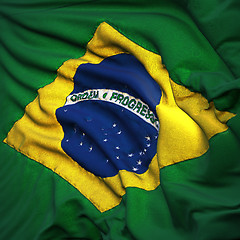 Image showing Flag of Brazil, fluttering in the breeze, backlit rising sun