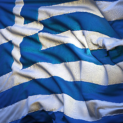 Image showing Flag of Greece, fluttering in the breeze, backlit rising sun