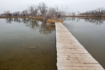 Image showing boardwalk pathway over lake and swamp