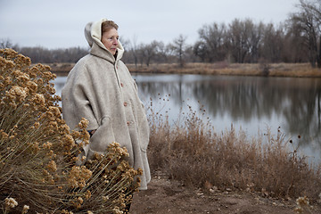 Image showing senior woman enjoys a walk outdoors