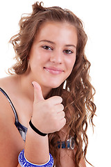 Image showing pretty girl with thumb raised as a sign of success,