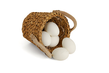 Image showing Eggs spilled from interwoven basket