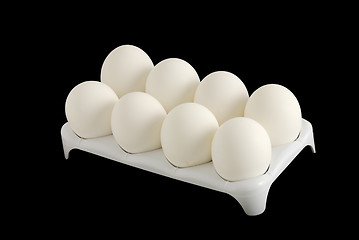 Image showing Eight white eggs in carton