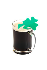 Image showing Glass of dark beer decorated with 4-leaf clover