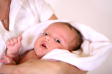 Image showing baby after bath in towel. soft focus 