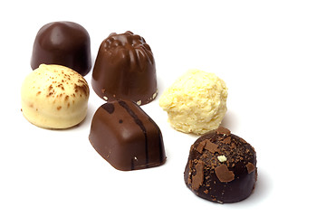 Image showing chocolate truffle in white background - focus on first 