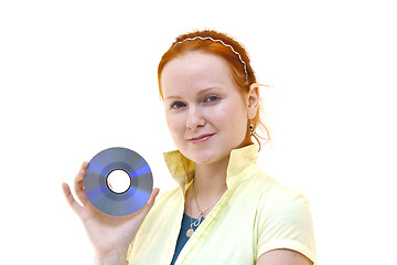 Image showing redhead young woman holding a CD