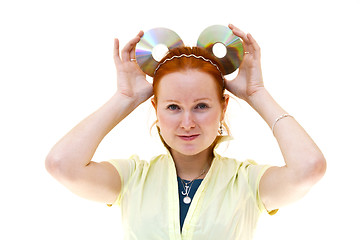 Image showing redhead young woman holding a CDs