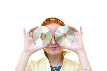 Image showing redhead young woman holding a CD