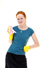 Image showing redhead young woman holding a rag