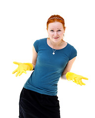 Image showing redhead young woman with yellow gloves