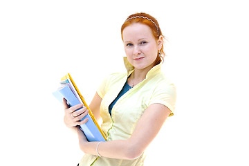 Image showing redhead young woman student holding a notebooks