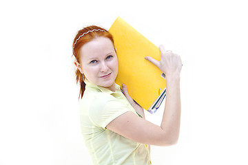 Image showing redhead young woman student holding a notebooks