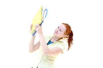 Image showing redhead young woman student holding a notebooks