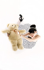 Image showing Young woman with teddy bear 