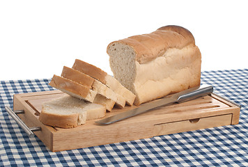 Image showing Slices of bread on top of wooden board