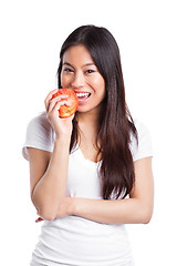 Image showing Asian woman eating apple