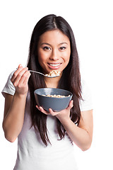 Image showing Asian woman eating cereal