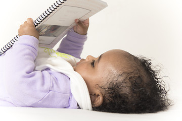 Image showing Baby reading a book