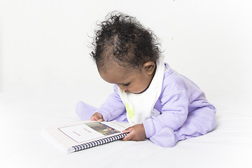 Image showing Baby reading a book