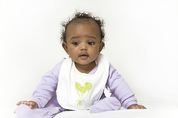 Image showing Baby girl learning to sit