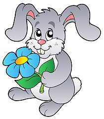 Image showing Cute bunny holding flower