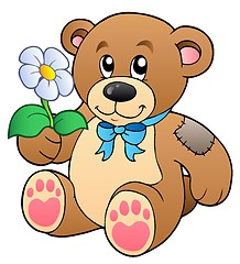 Image showing Cute teddy bear with flower
