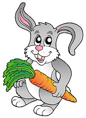 Image showing Cute bunny holding carrot