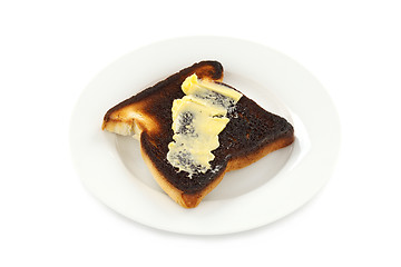 Image showing Butter On Burnt Toast