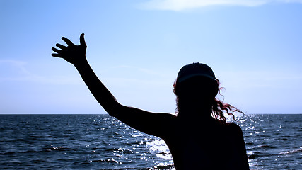 Image showing Silhouette of woman against the sea