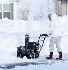 Image showing Woman Blowing Snow