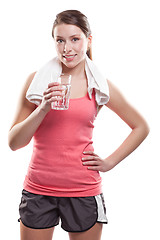 Image showing Sporty woman holding water