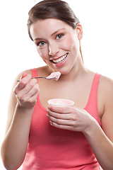 Image showing Woman eating yogurt