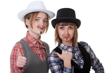 Image showing Two girls with painted mustaches