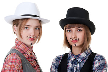 Image showing Two girls with painted mustaches