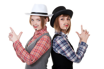 Image showing Two girls with painted mustaches