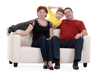 Image showing family with son sitting on a sofa