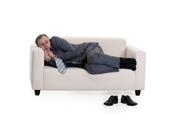 Image showing businessman sleeping on a sofa