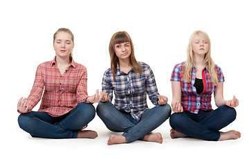 Image showing Three girls sitting in lotus posture